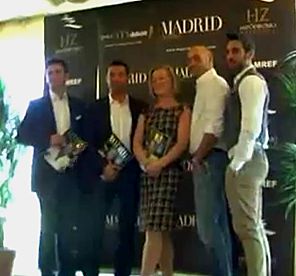 Dame Claudia Trimde with guests holding the MADRID deluxe issue at its launch at the Hipódromo de La Zarzuela, Madrid